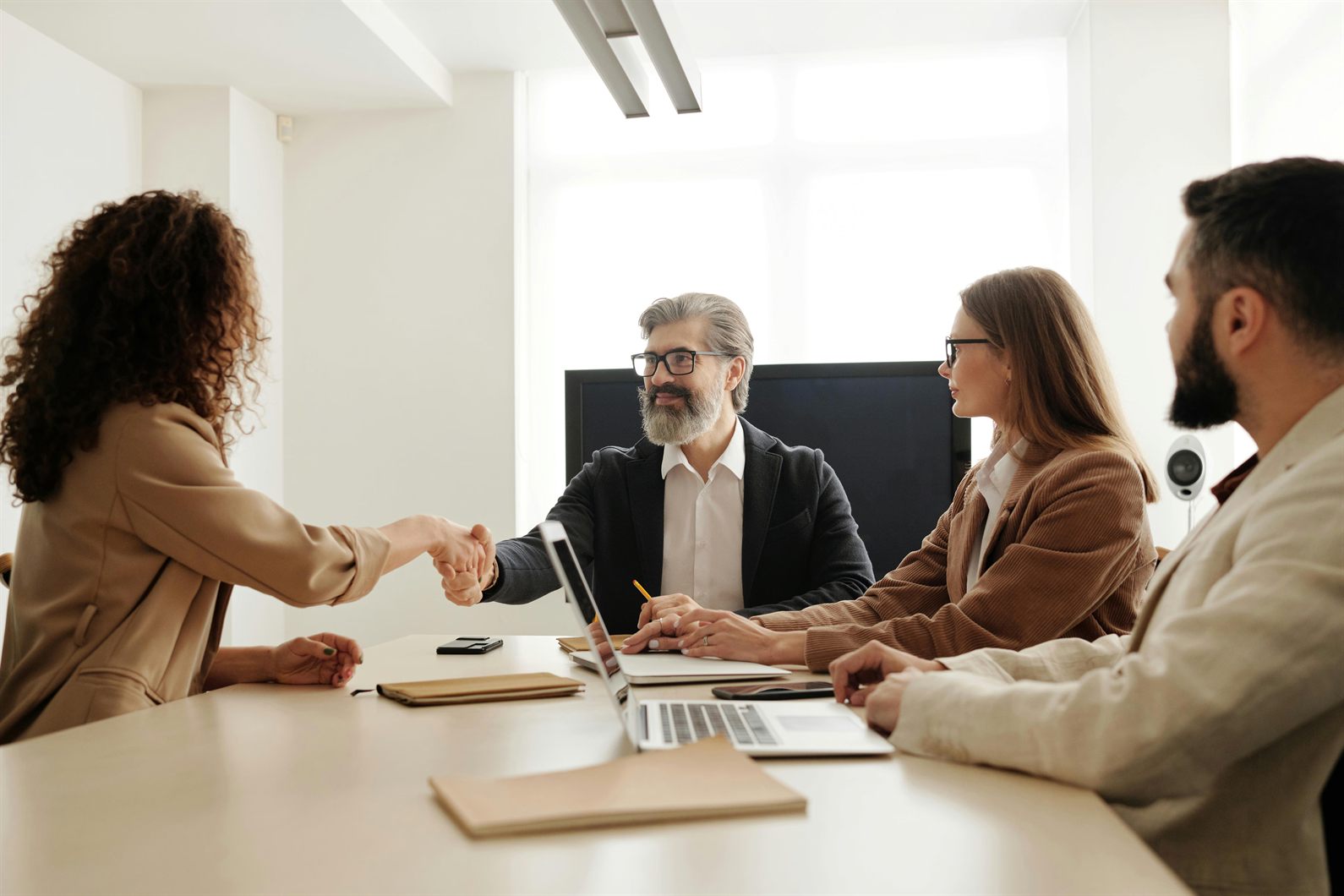 Hiring team meeting around a conference table